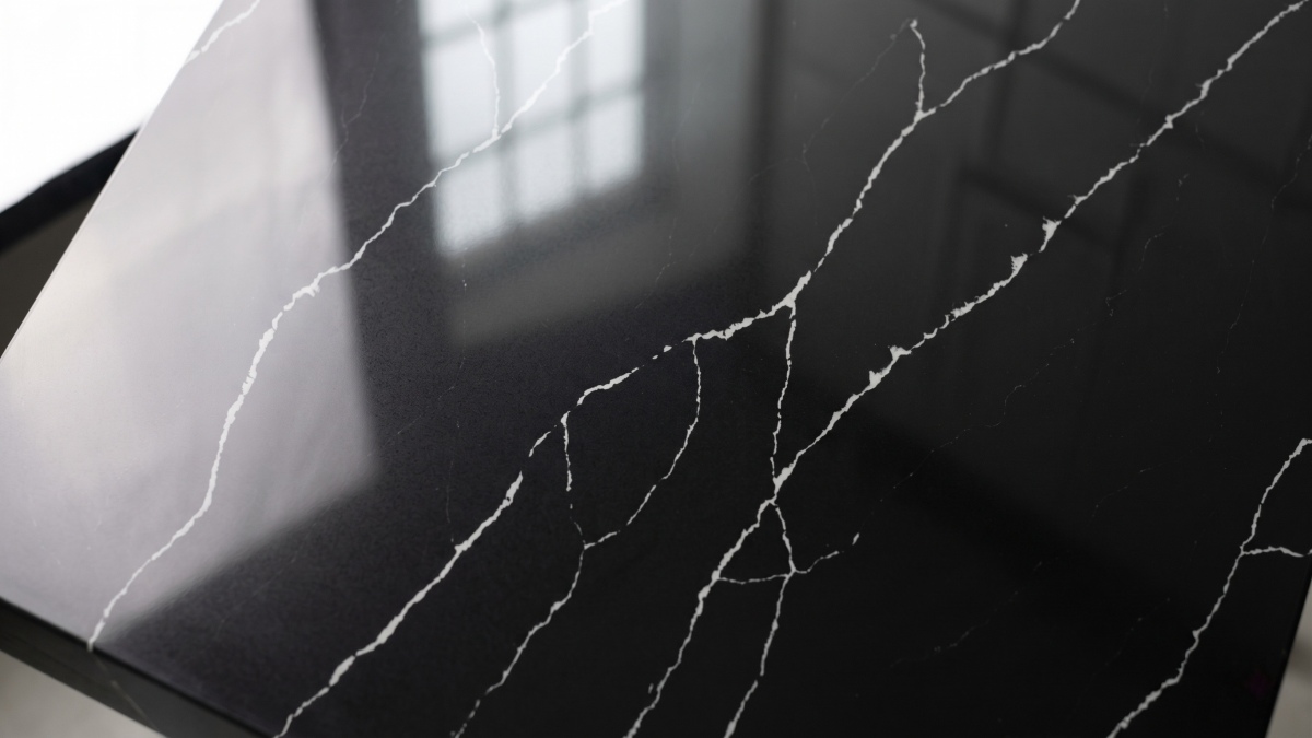 Deep black quartz surface with diagonal white lines