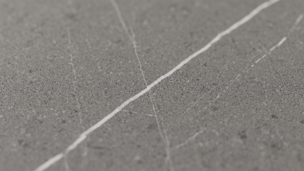 Surface texture close-up of slate grey quartz with subtle marble-look movement