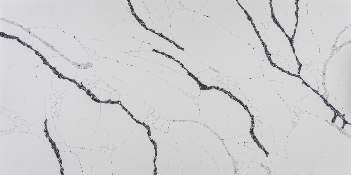 Full slab view of Graphite Rift White Quartz with bold black vein movement
