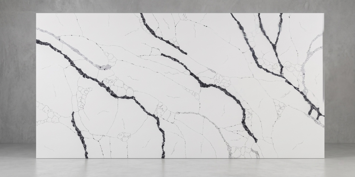 White quartz slab on rack with dramatic graphite veining for countertops