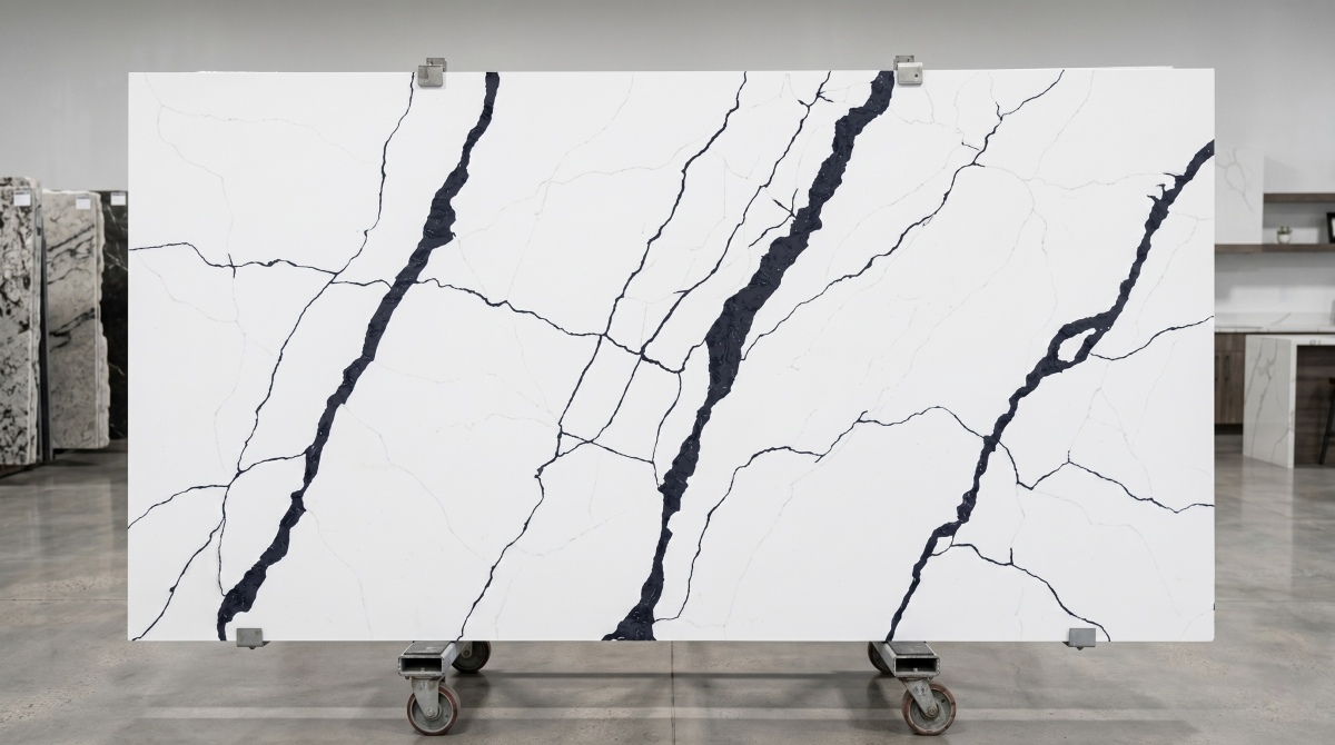 Full slab view of Steel Rift White Quartz with bold steel grey veins