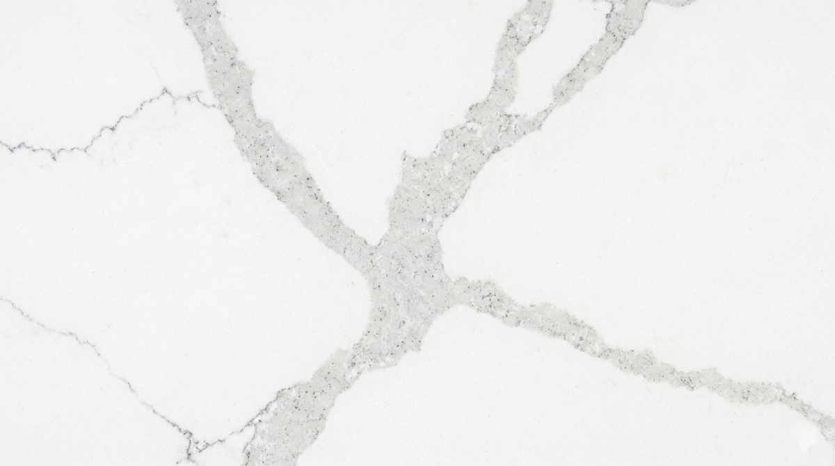 White engineered quartz slab with subtle grey marble-look veins