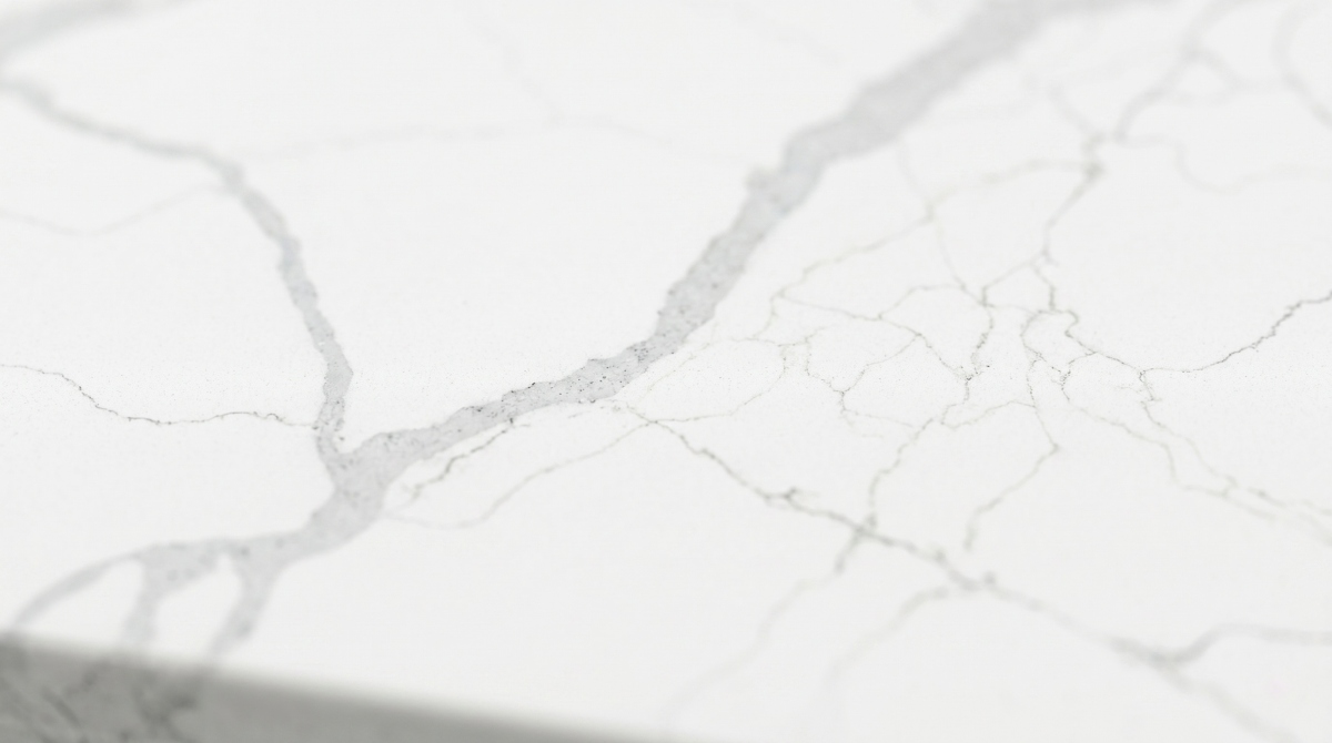 Polished white quartz surface with low-contrast soft grey movement