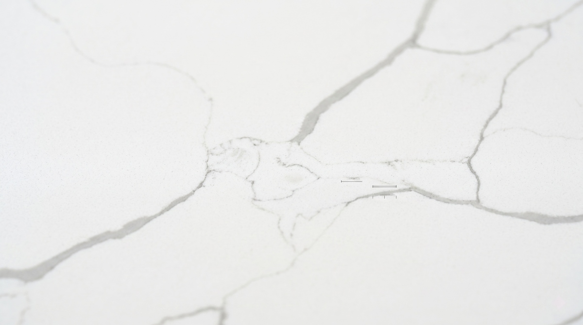 classic-calacatta-white-quartz-vein-close-up Close-up detail of soft grey veining in Classic Calacatta White Quartz