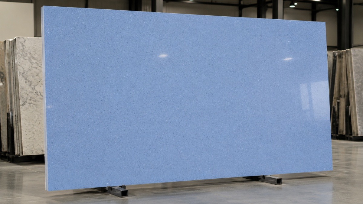 Blue Sky Speckled Man Made Stone panel with polished blue grey base and fine granular texture
