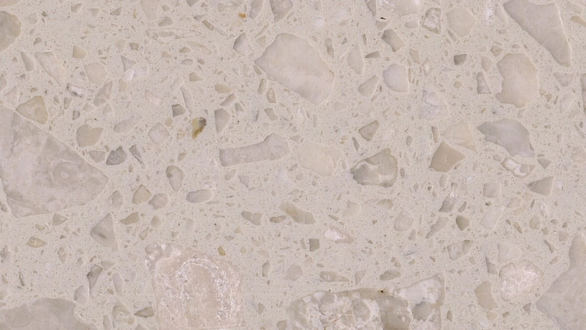 cream-rose-artificial-stone-texture-close-up Close-up texture of Cream Rose Artificial Stone with cream matrix and irregular marble chips