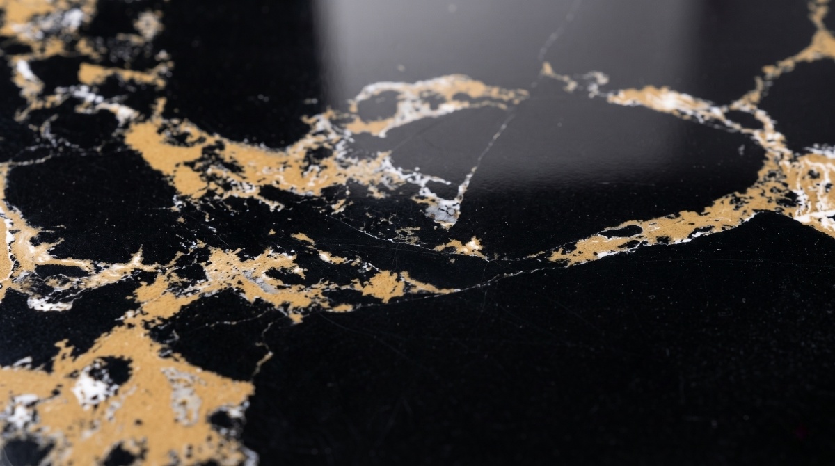 black-portoro-gold-artificial-marble-texture-close-up Close-up texture of Black Portoro Gold Artificial Marble with gold and white vein movement