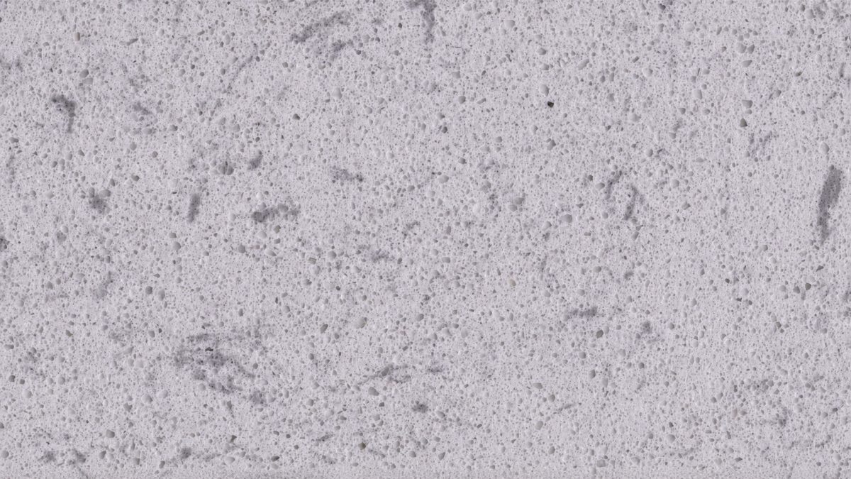 Close-up texture of white crystalline artificial marble stone with fine particles