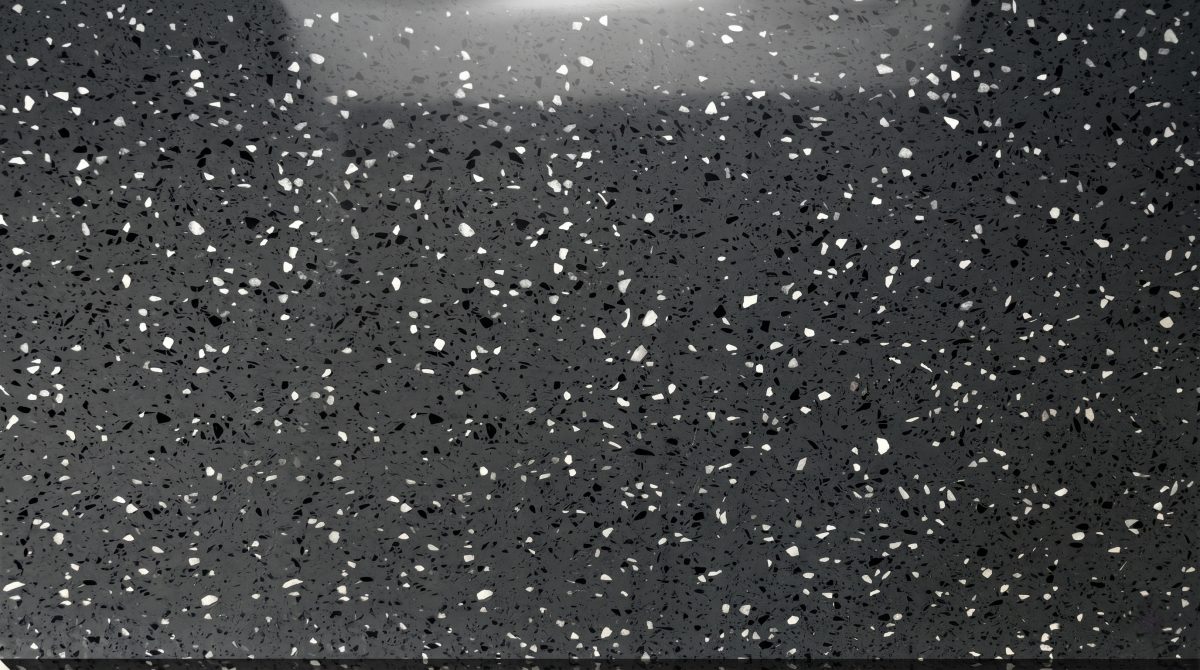 charcoal-chip-grey-artificial-marble-texture-close-up Close-up texture of charcoal grey artificial marble with chip particles