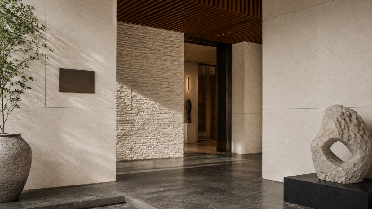 cotswold-cream-limestone-courtyard-entrance-wall-cladding Cotswold Cream Limestone wall cladding used in a contemporary courtyard entrance with warm metal details