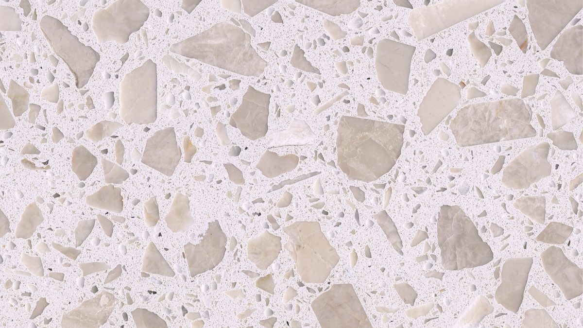magnolia-white-terrazzo-aggregate-close-up Close-up of Magnolia White terrazzo with oversized pale beige fragments and dense fine aggregate