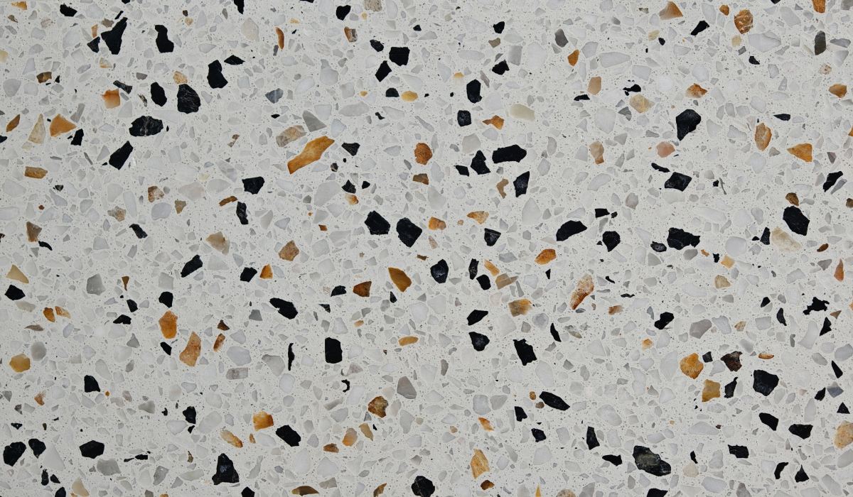 terrazzo-hibiscus-white-aggregate-close-up Close-up of Hibiscus White Terrazzo with white, black, grey, and amber chips