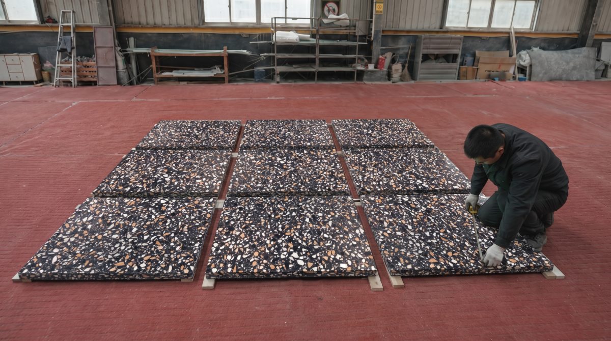 amber-night-black-terrazzo-dry-lay-inspection •Amber Night terrazzo cut pieces arranged for dry-lay visual inspection before packing