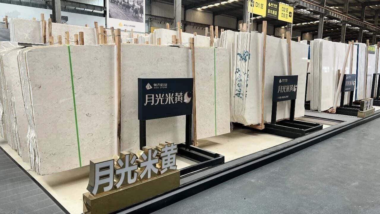 moon-beige-limestone-range-approval Project team reviewing Moon Beige limestone slab range and finish samples before cutting