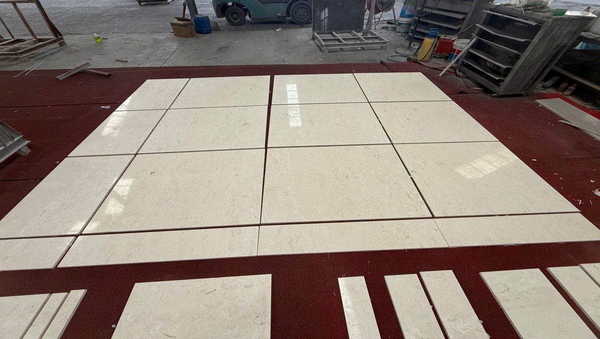moon-beige-limestone-dry-layout-inspection Cut-to-size Moon Beige limestone panels arranged for tone and sequence inspection
